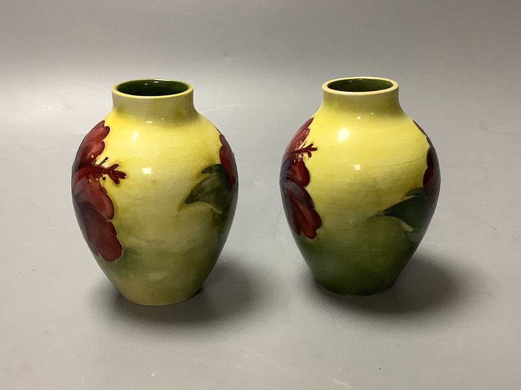 A pair of Moorcroft yelow ground Hibiscus vases, height 9cm